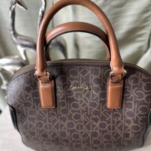 This medium hand bag is perfect for work, school or travel by Calvin Klein.